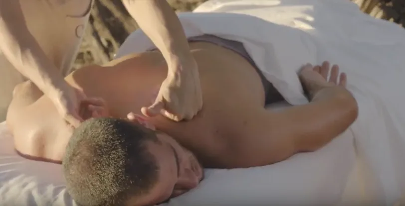 Professional massage table fully set up inside a private villa suite